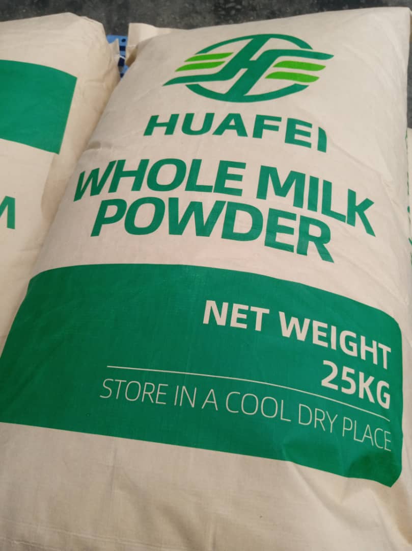 IMG-20260629-WA0010 Bag labeled Huabei Whole Milk Powder, 25 kg net weight, store in a cool dry place