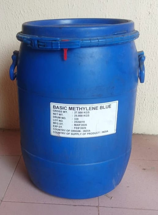 Blue plastic drum used for chemical storage with a label reading 'Basic Methylene Blue'.